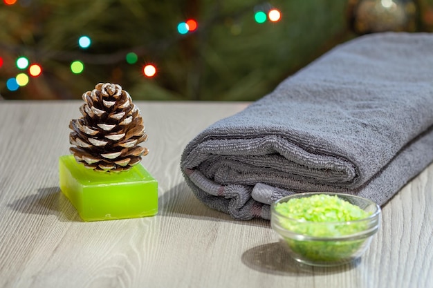 Spa composition with towel sea salt soap and pine cone