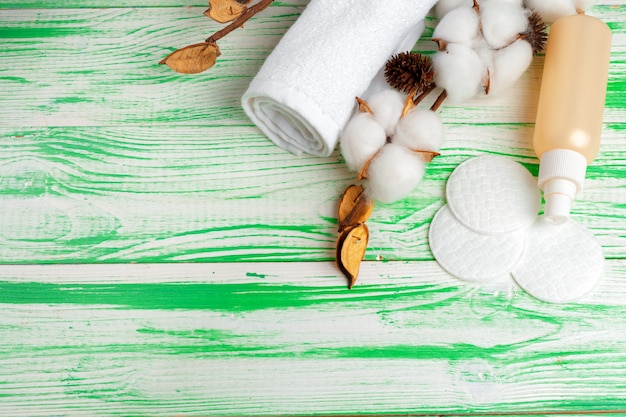 Spa concept. Flat lay background with cotton branch, cotton pads. Cotton Cosmetic Makeup