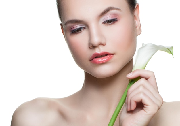 Spa face Young woman with white flower isolated on white background