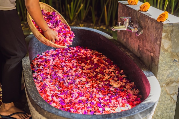 Spa petals in bowl with tropical flowers spa pedicure treatment