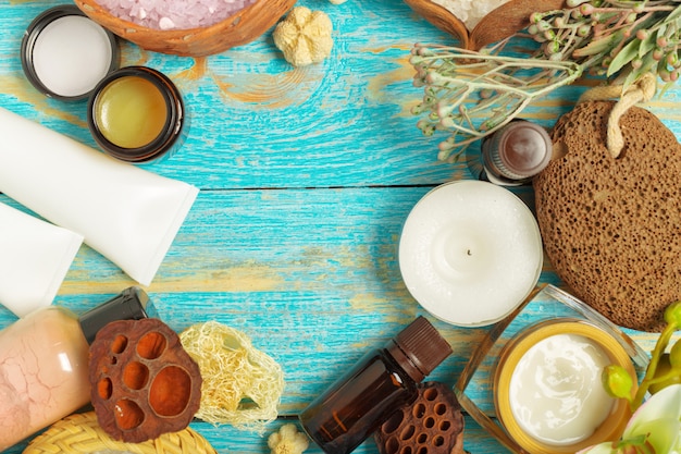 Spa products on wooden table with copyspace