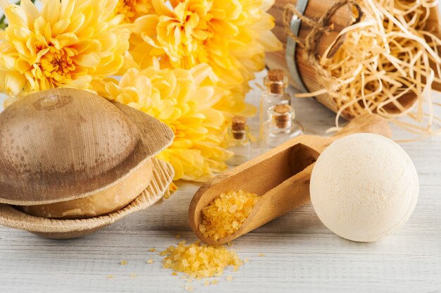 Spa setting with yellow daisy flowers, cosmetcics 