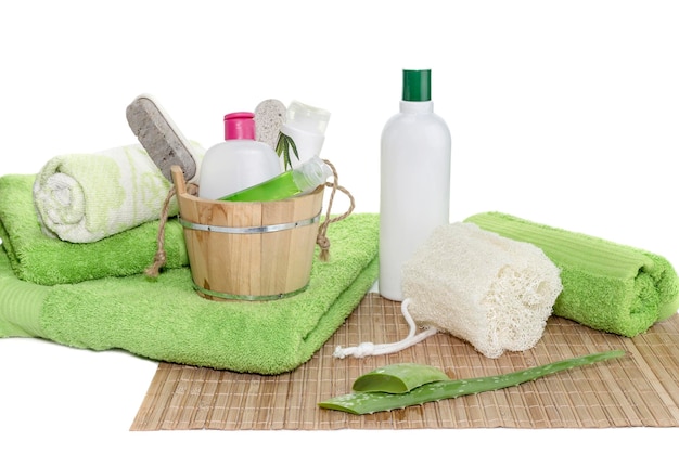 Photo spa still life personal hygiene items green towels natural sponge and aloe leaves on a table closeup