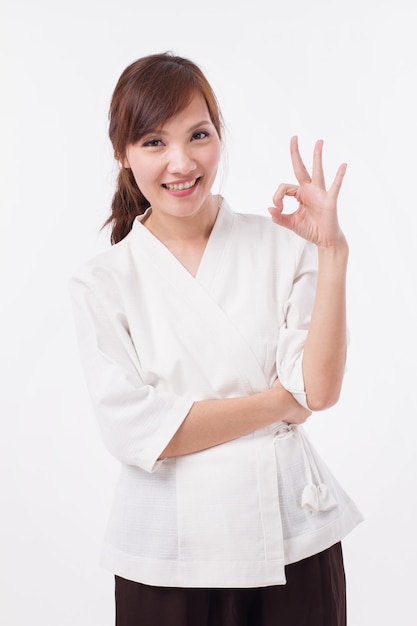 Spa therapist giving ok hand gesture