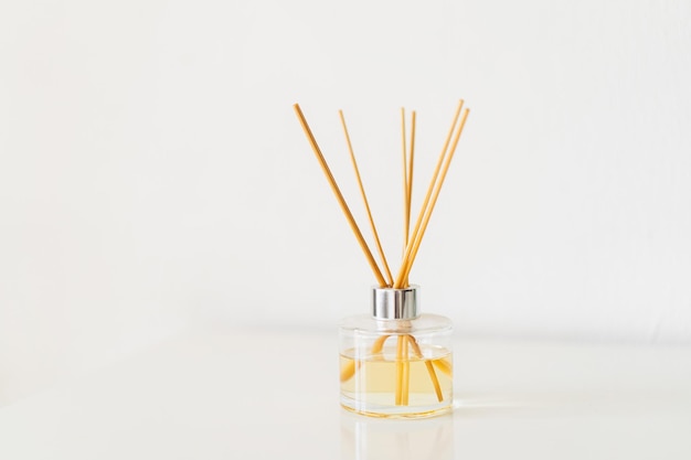 Spa therapy aromatherapy Diffuser bottle on a white background Incense sticks for the home with a floral scent The concept of ecofriendly fragrance for the home