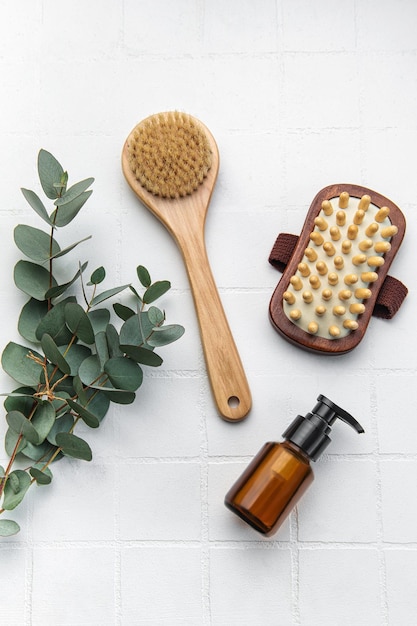 Spa treatment concept natural spa cosmetics products with eucalyptus oil massage brush eucalyptus leaf