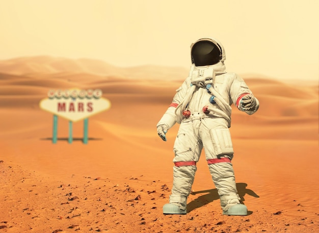 Spaceman walks on the red planet Mars Space Mission Welcome to Mars sign Astronaut travel in space