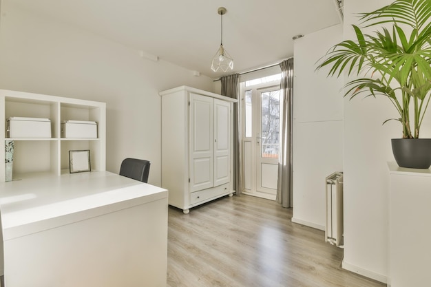 Spacious attic room with sofa and kitchen