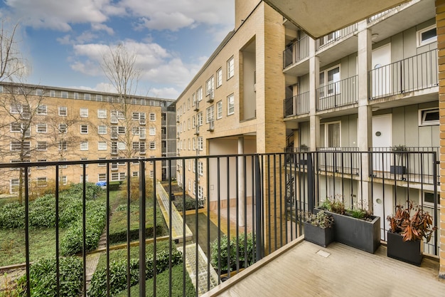 A spacious balcony with a metal fence