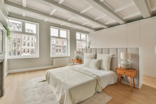 Spacious bright bedroom with a vintage bedside tables and wardrobes