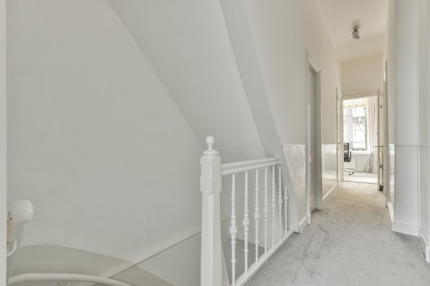 Spacious bright corridor with stairs and entrance to the attic room