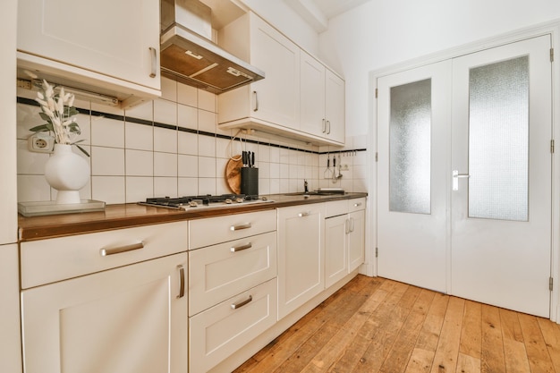 Spacious bright white kitchen with corridor