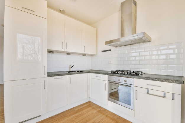 Spacious bright white kitchen with corridor