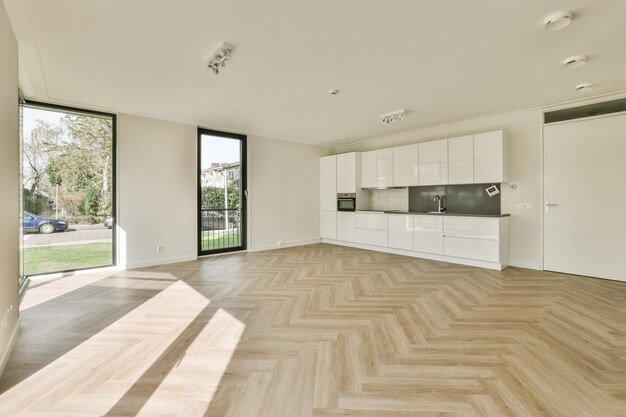 Spacious bright white kitchen with windows