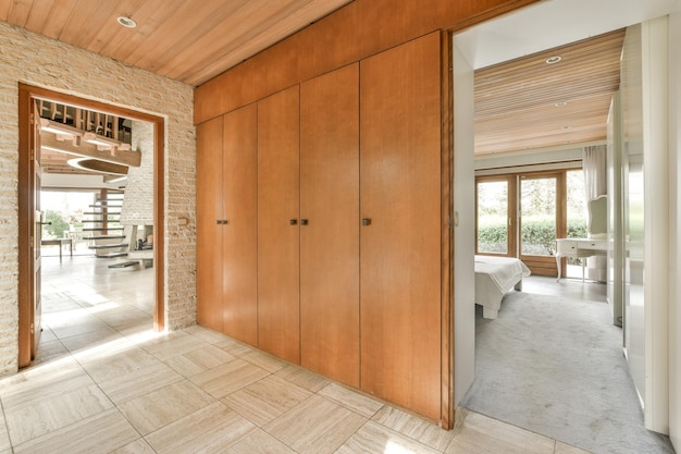 Spacious corridor with closet and cabinet