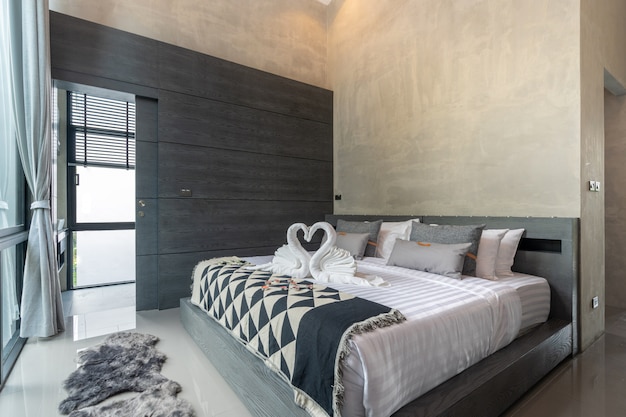 Spacious modern loft bedroom with blue bed liner