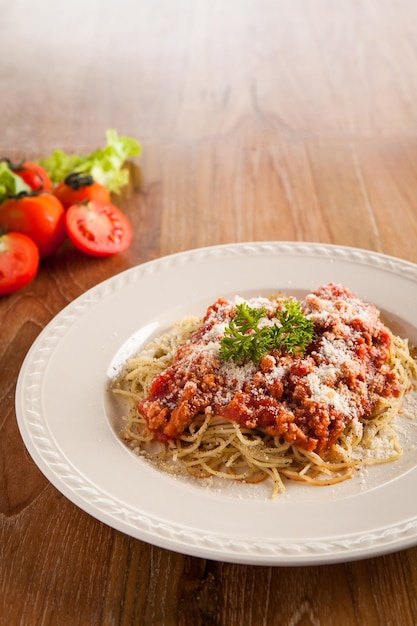 Spaghetti Bolognese on Wooden Table