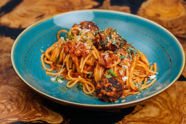 Spaghetti Con Polpette meat balls served in plate isolated on table side view of italian fastfood