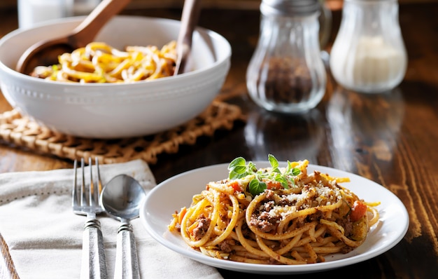 Spaghetti dinner with beef, parmesan and oregano