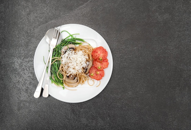 Spaghetti mushrooms vegetables Food background