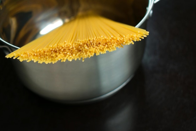 Spaghetti in pot top view. Close-up.