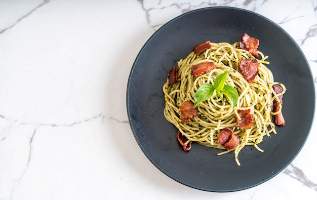 Spaghetti with basil pesto and bacon