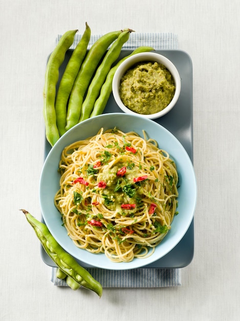 Spaghetti with bean broad sauce and hot chili pepper