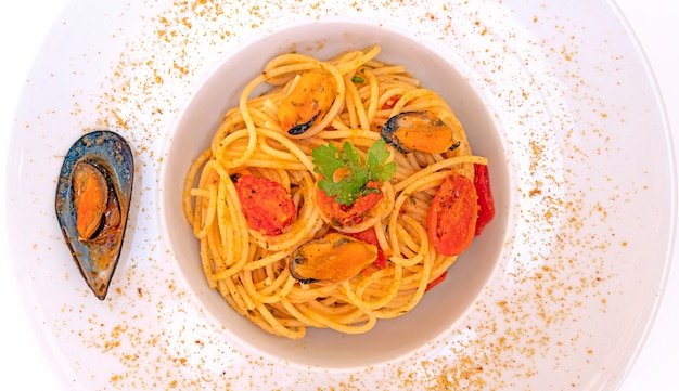 Spaghetti with mussels bottarga fish and cherry tomatoes