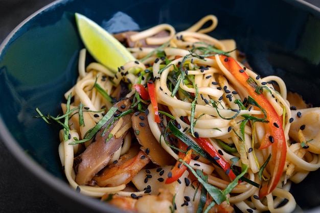 Spaghetti with seafood on a dark background