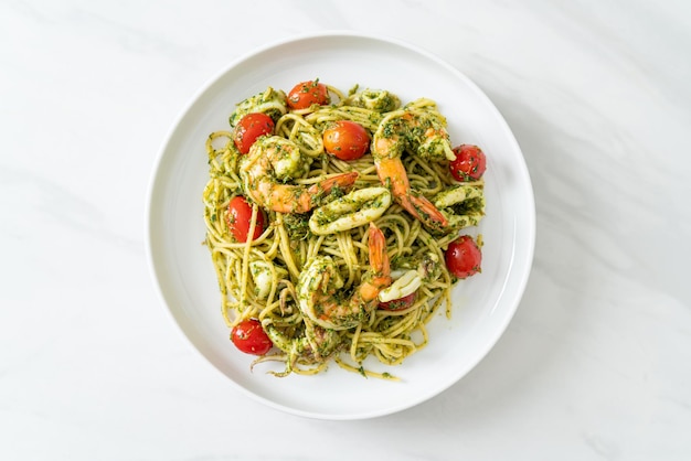 Spaghetti with seafood in homemade pesto sauce