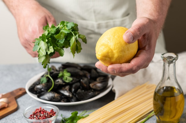 spaghetti with seafood mussels parsley lemon and olive oil Home cooking concept