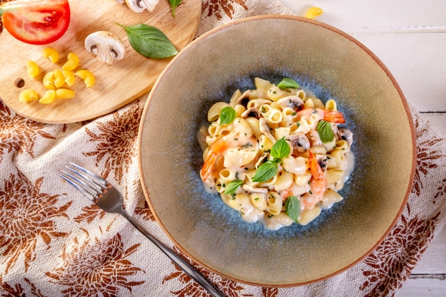 Spaghetti with shrimp and basil on a plate