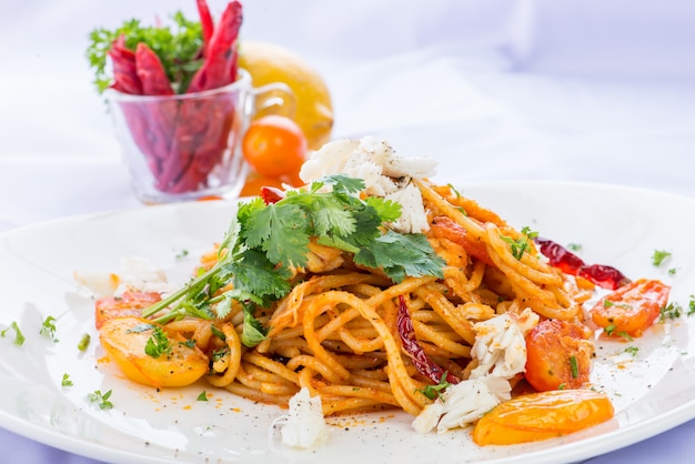 Spaghetti with tomato sauce and crabs