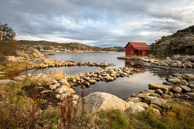 Spangereid, Norway, October 2019: Boat house by the fjord