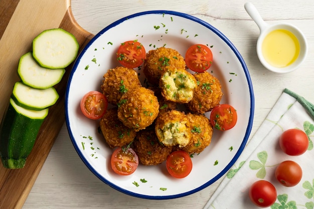 Photo spanish chickpea croquettes with eggplant and zucchini