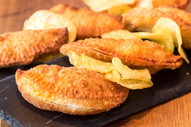 Spanish empanadillas on slate