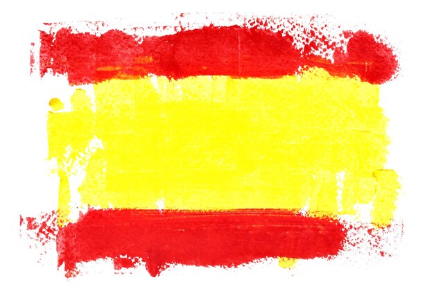 Photo spanish flag by brush strokes isolated on the white background