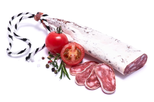 Spanish fuet thin dried salami sausage isolated on a white background