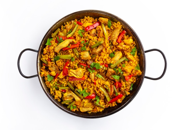 Spanish paella rice with chicken on white background