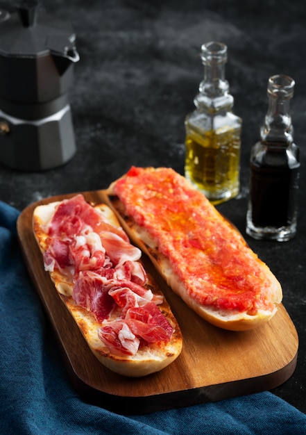 Spanish tomato and ham toast, traditional breakfast or lunch