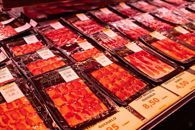 Spanish traditional iberico jamon prosciutto premium meat on the famous market barcelona catalonia s