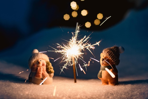 Sparkler in the snow in the evening