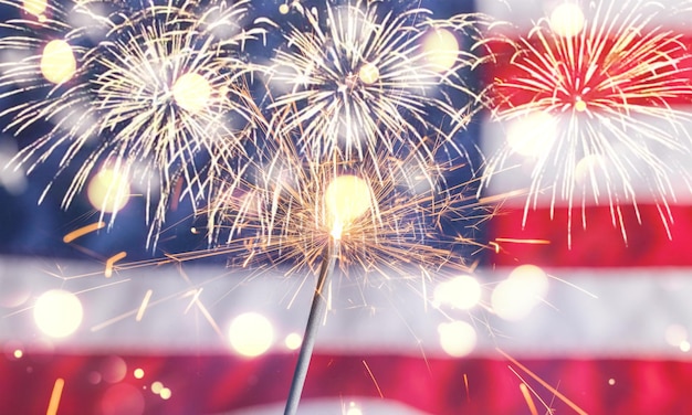 Sparkler and usa flag showing 4th of july