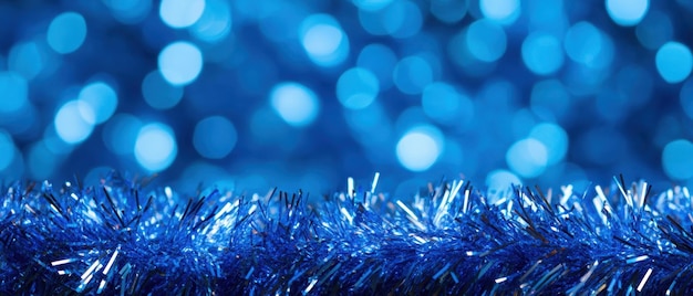 Photo sparkling blue christmas tinsel frame with festive bokeh background