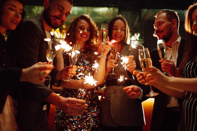 Sparkling sparklers in the hands Playing firework to celebrate winter holidays Magic New Year