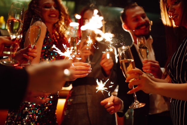 Sparkling sparklers in the hands Playing firework to celebrate winter holidays Magic New Year