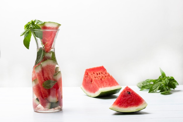 Sparkling watermelon water with basil in glass jar