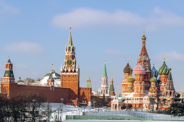 Spasskaya Tower of the Kremlin and St Basils Cathedral in winter Moscow Russia