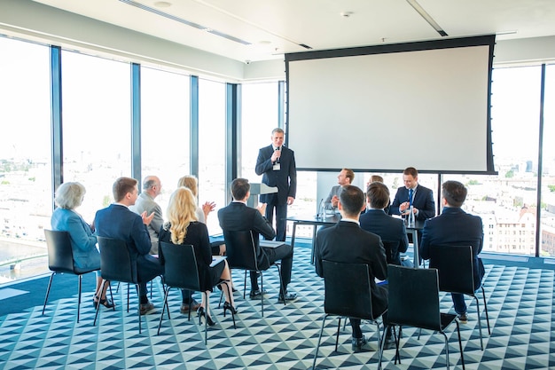 Speaker and audience at conference