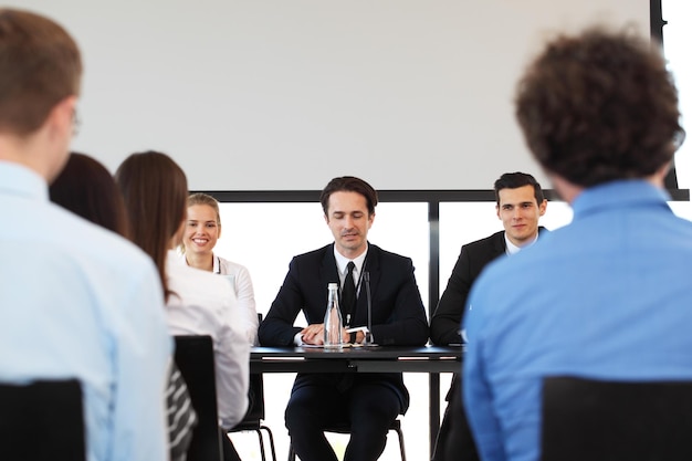 Speakers at business meeting